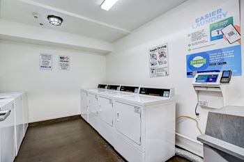 On-site laundry room with washers and dryers